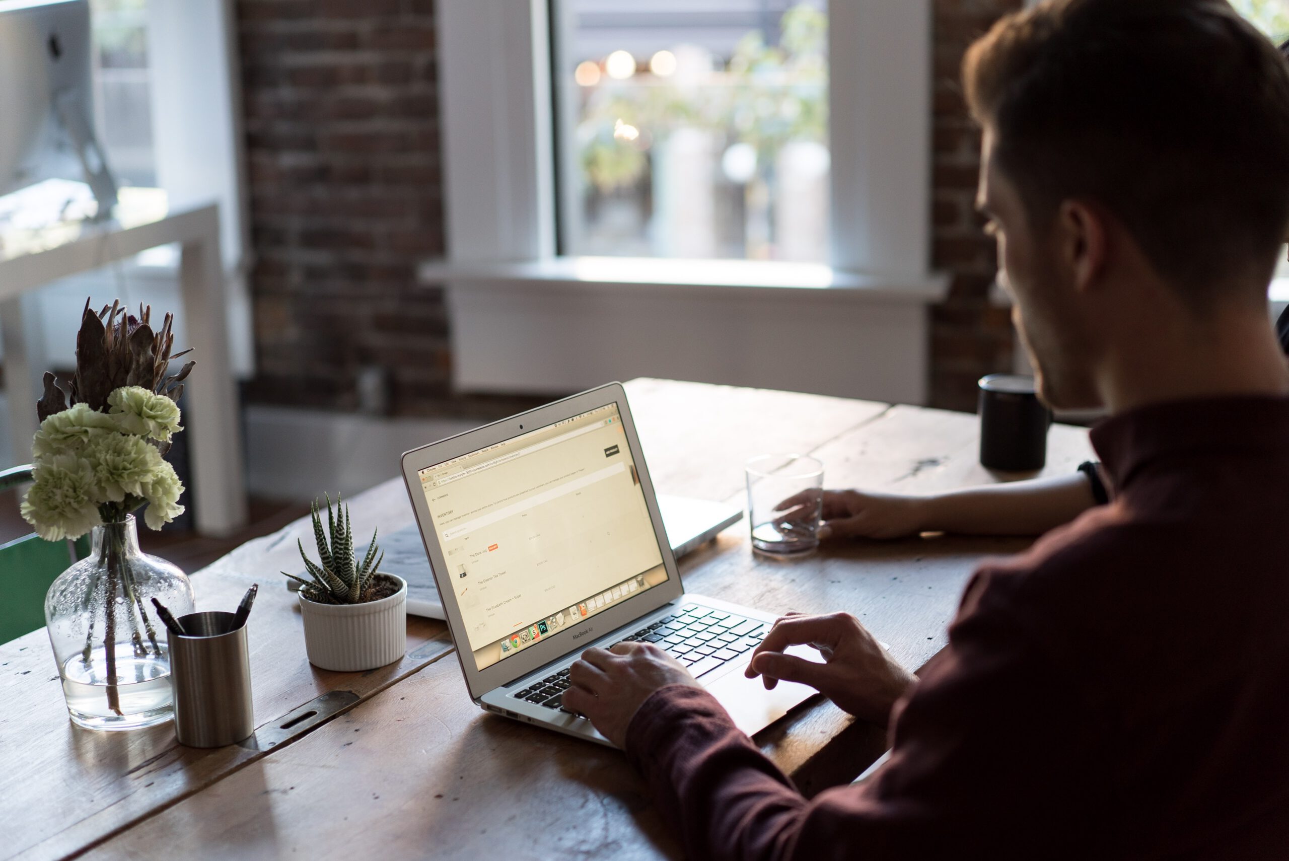 An image of a man in front of a computer