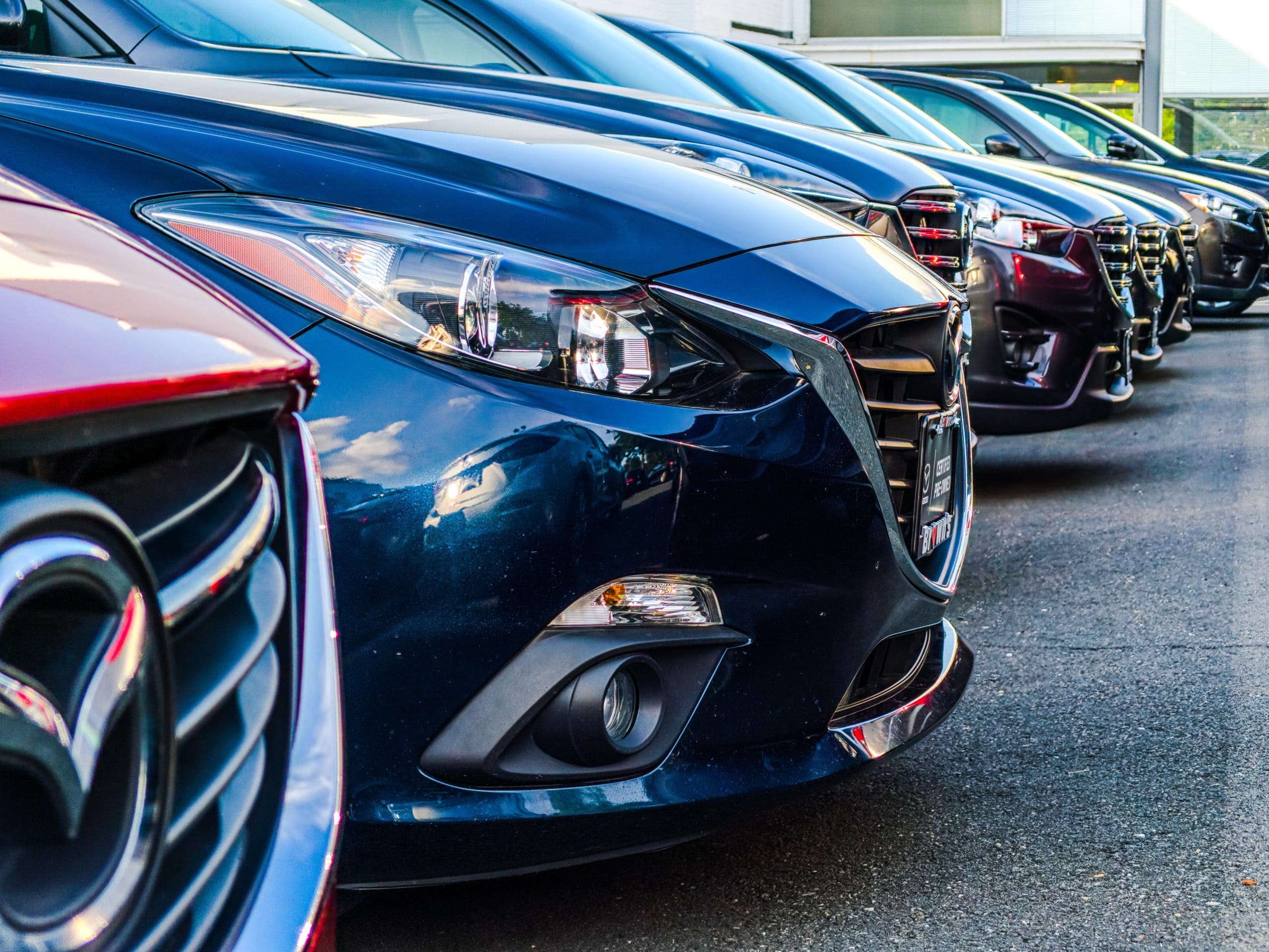 An image of a bunch of automobiles at a car dealership