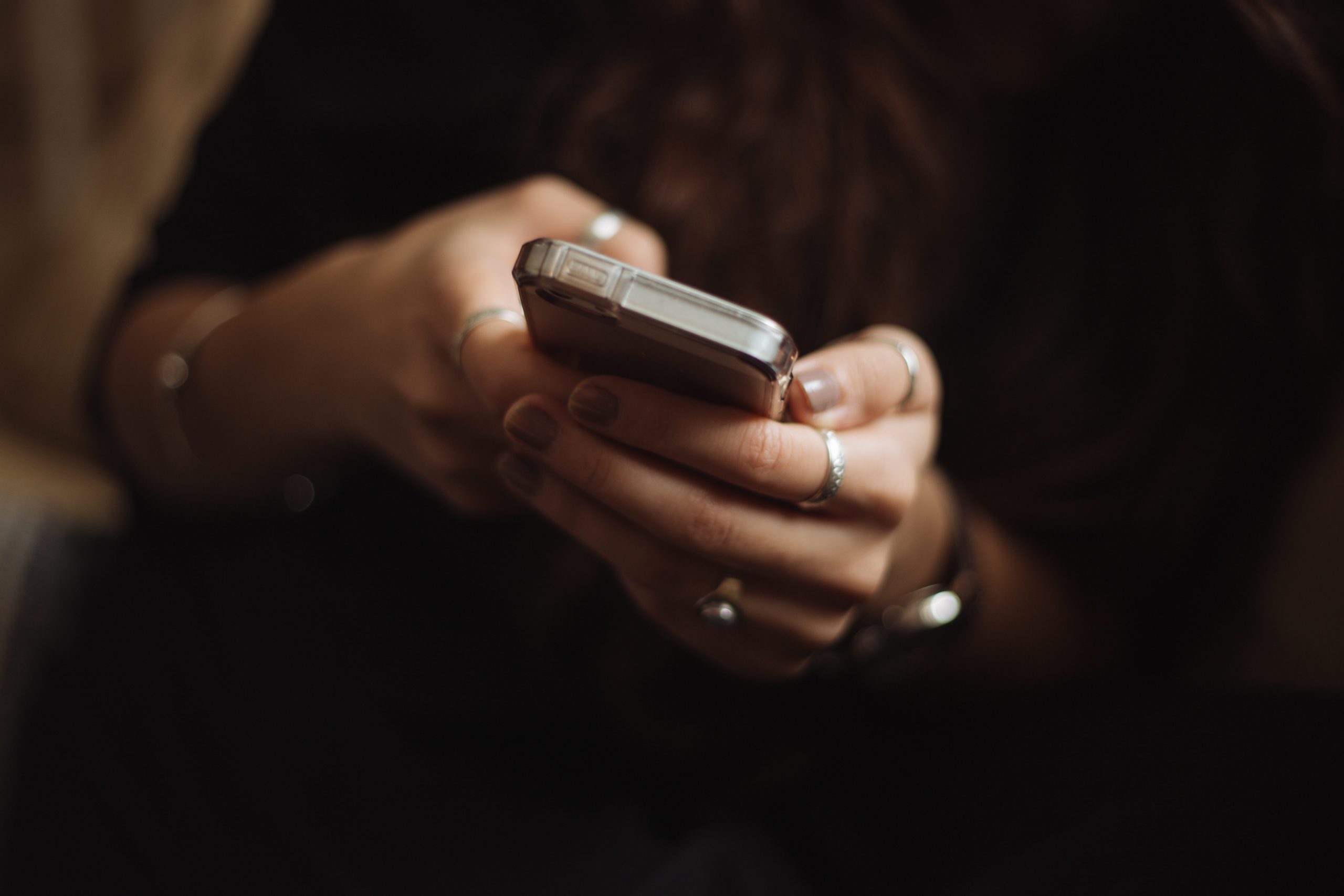 An image of a woman using her smart phone