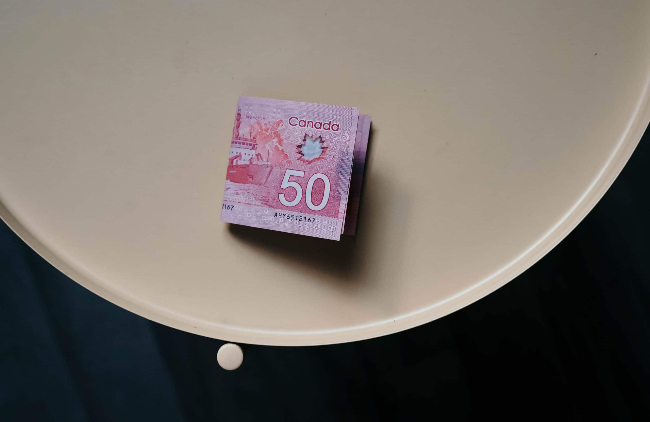 An image of a fifty dollar bill on a table