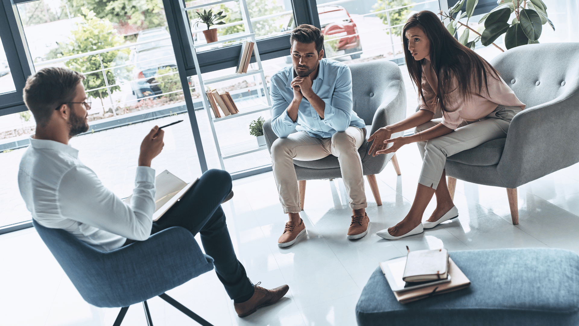 An image of a small business advisor chatting with two of his clients about their trusts