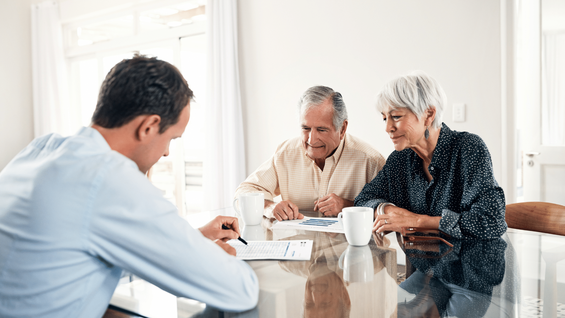 An image of an Oakville couple who are discussing how to convert RRSP into RRIF in a tax-efficient manner