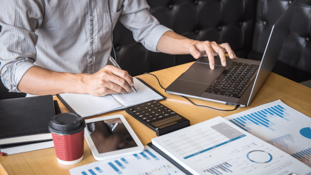 An image of an accountant and tax consultant reviewing a clients files