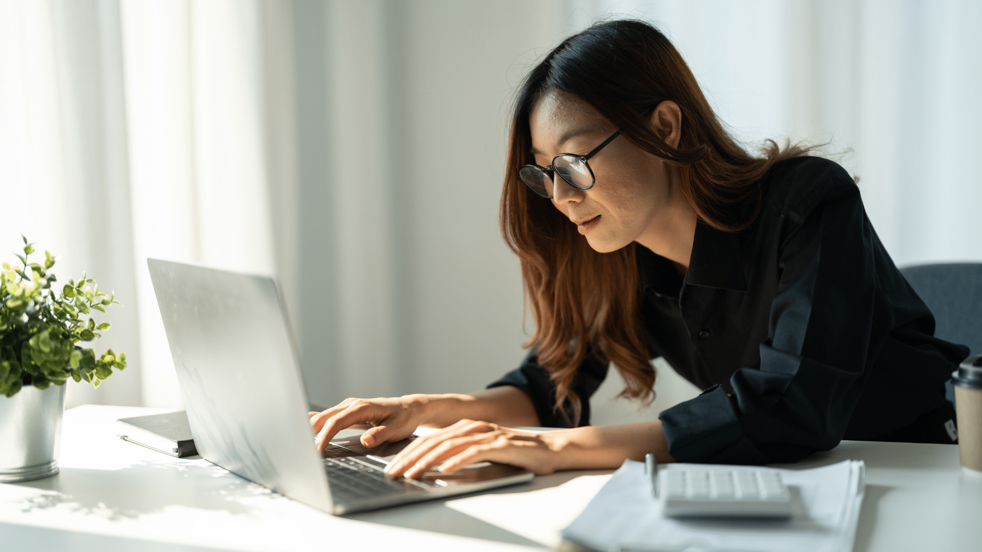 An image of an Oakville small business owner reviewing the CRA’s General Anti-Avoidance Rule on her laptop.