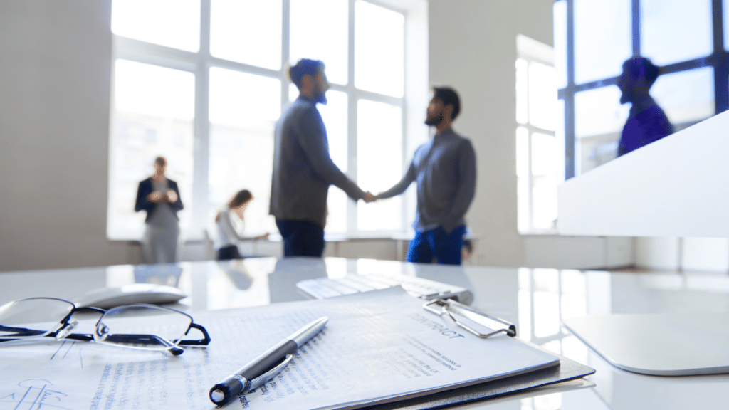 An image of two business owners shaking hands after agreeing on a share structure for their small Oakville Ontario business