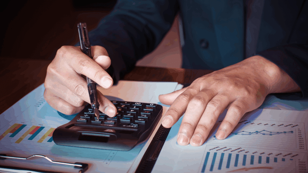 An image of a local Oakville bookkeeper reviewing his client's operating expenses