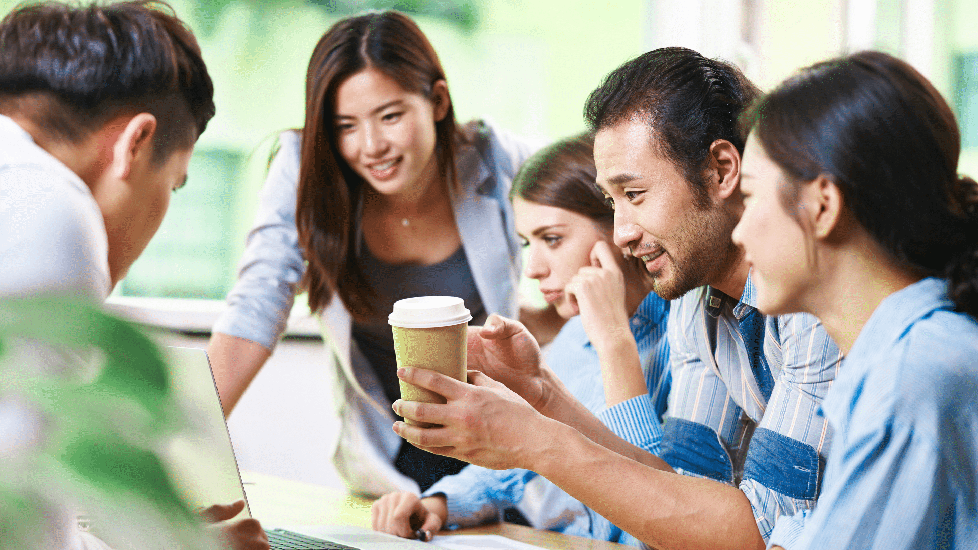 An image of a team meeting at a small business in Oakville Ontario where they are discussing redundant assets