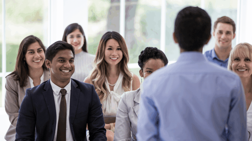 An image of a small business owner in Oakville who is discussing Employee Ownership Trusts (EOTs) with his staff