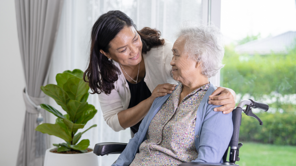 An image of a nurse helping a elderly lady at a long-term care facility in Oakville Ontario